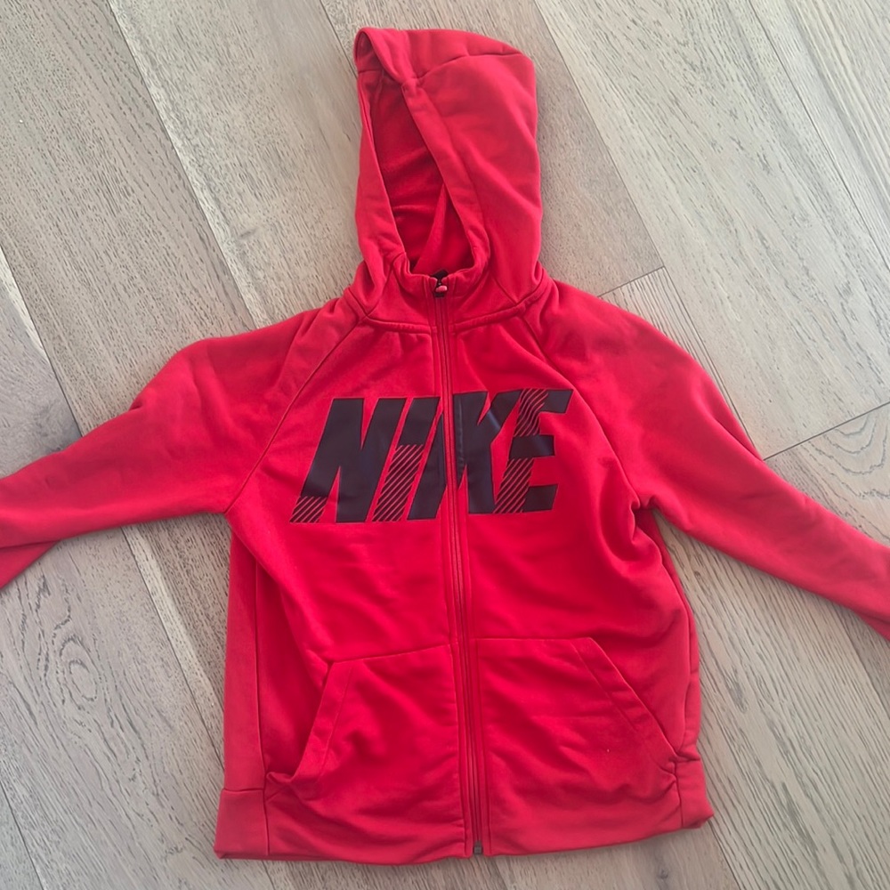 Red Nike zip up hoodie. Excellent condition. Kids large.